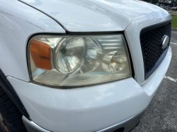 2006 Ford f150 v8 long bed ( low mileage )+-4doors full